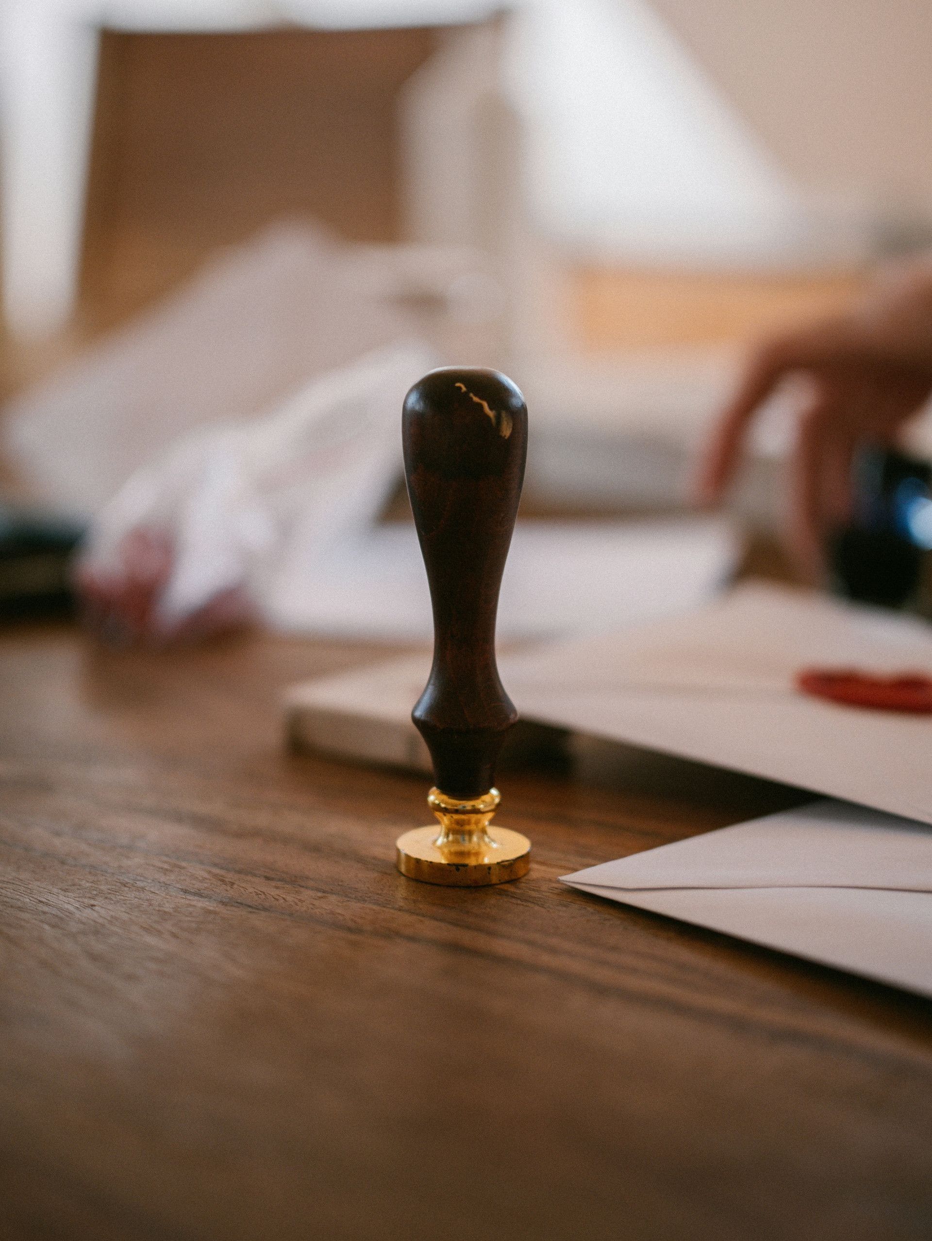 A wooden wax seal stamp on a table
